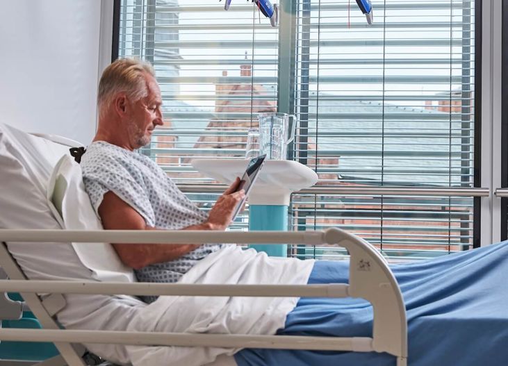 Med Uclh Patient In Bed Browsing Menu 02